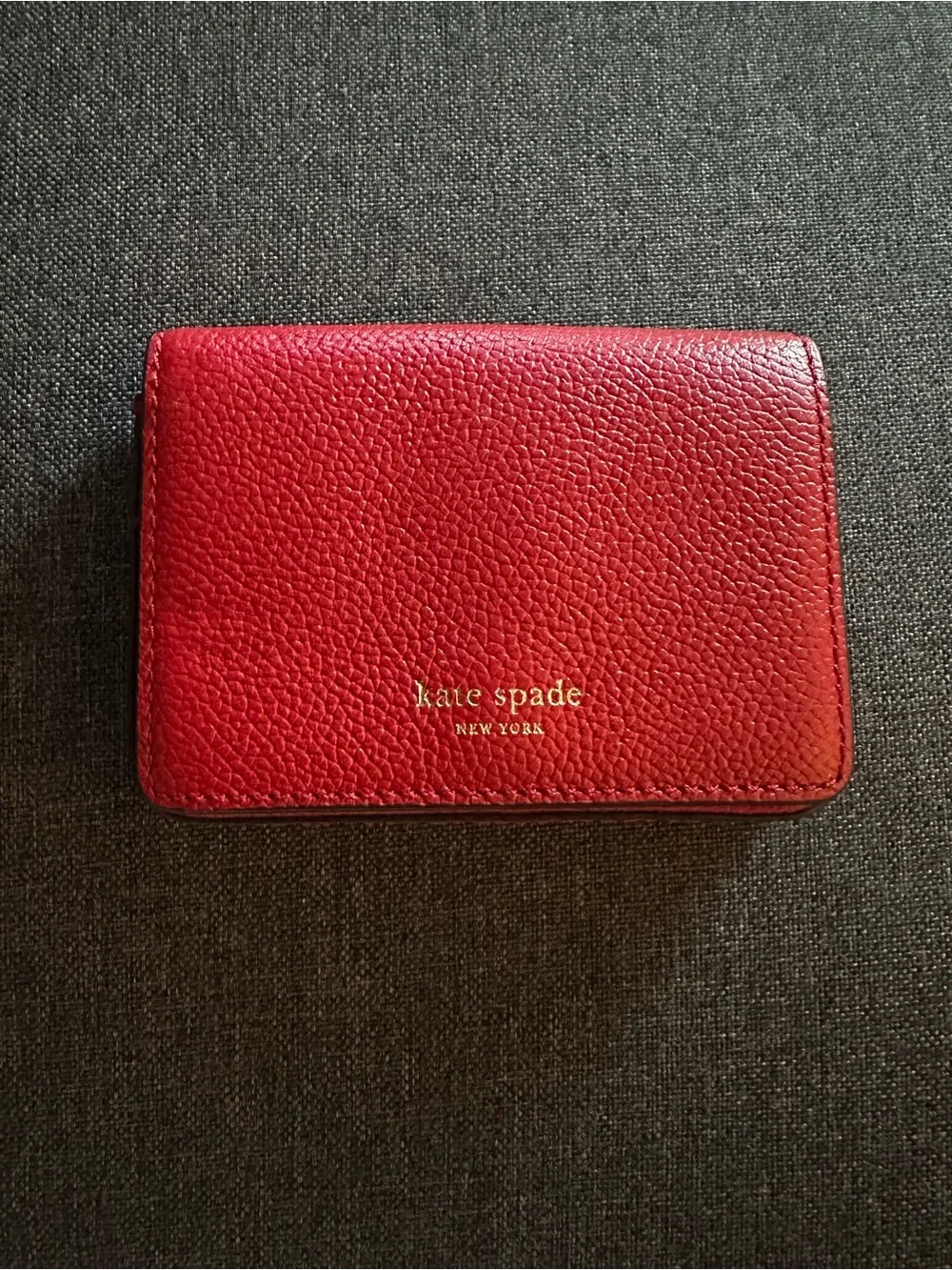 kate spade red pebbled leather small wallet with gold logo